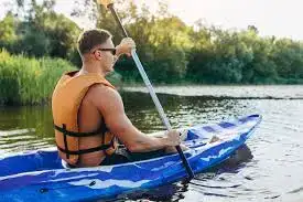 Family kayaking on a calm part of the Semois near Vresse